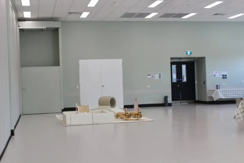 Empty community hall with grey walls before the set-up